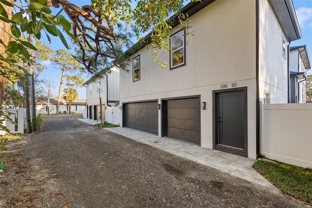 view of side of home featuring a garage