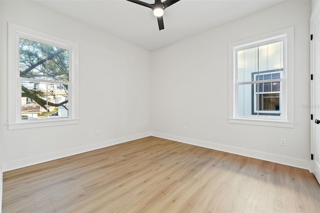 spare room with ceiling fan and light hardwood / wood-style floors