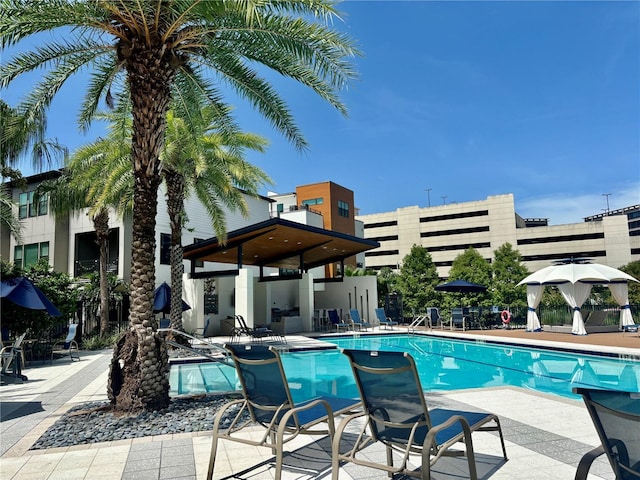 view of swimming pool featuring a patio area