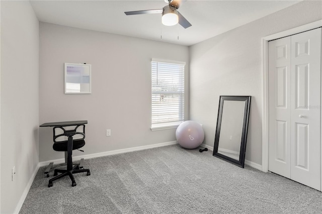 office space with light colored carpet and ceiling fan