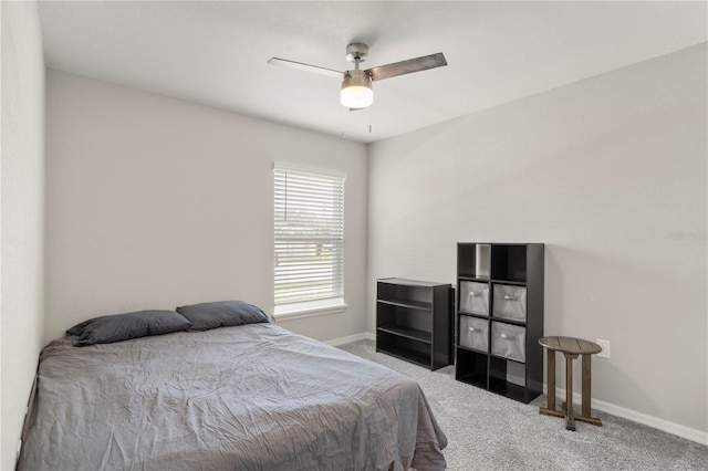 bedroom featuring ceiling fan and carpet