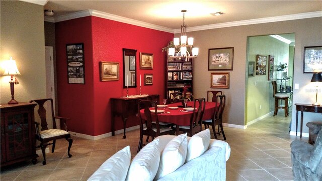 dining room with an inviting chandelier, tile patterned flooring, and ornamental molding