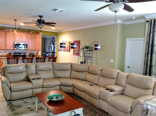 living room with ornamental molding and ceiling fan