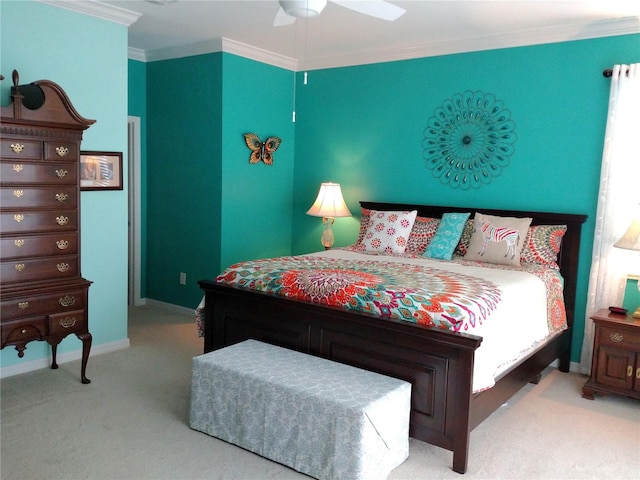 bedroom with crown molding, ceiling fan, and carpet flooring