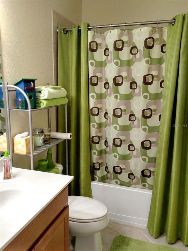 full bathroom featuring vanity, shower / bathtub combination with curtain, tile patterned flooring, and toilet