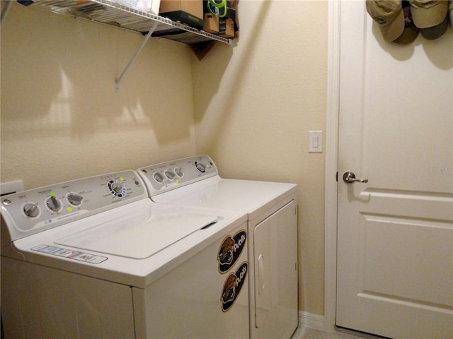 washroom with separate washer and dryer