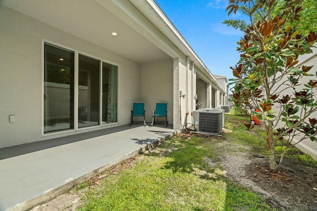 view of yard featuring a patio area and cooling unit