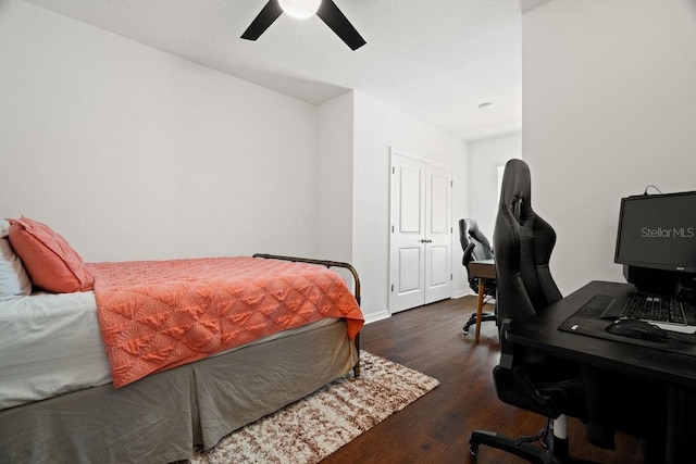 bedroom featuring dark wood-type flooring and ceiling fan