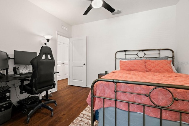 bedroom featuring ceiling fan and dark hardwood / wood-style flooring