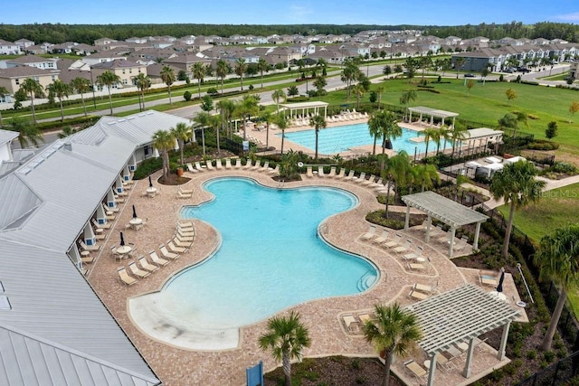 view of swimming pool featuring a patio area and a pergola