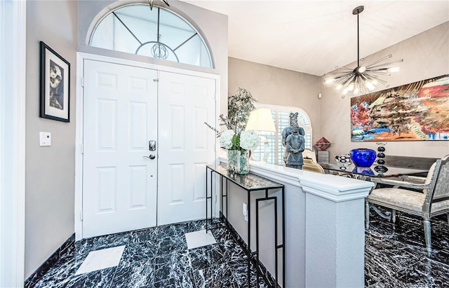 entryway featuring an inviting chandelier