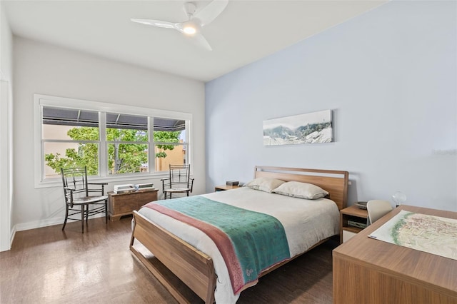 bedroom featuring dark wood-type flooring and ceiling fan