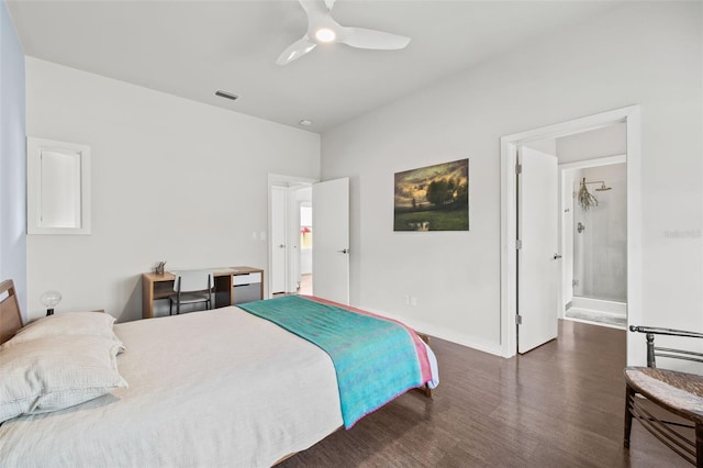 bedroom featuring dark wood-type flooring, ceiling fan, and ensuite bath