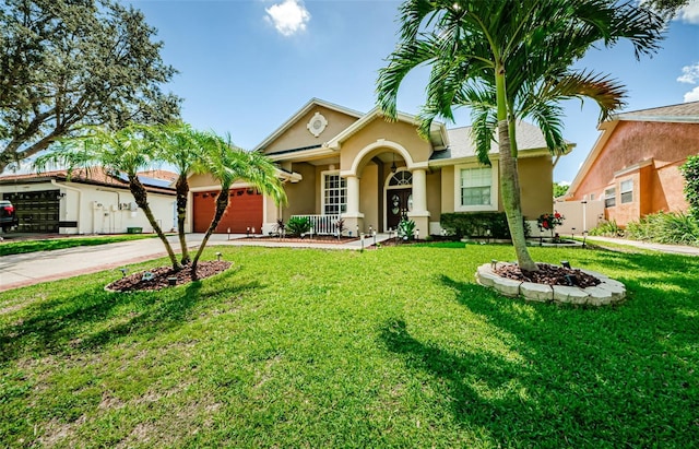 ranch-style home with a front lawn and a garage