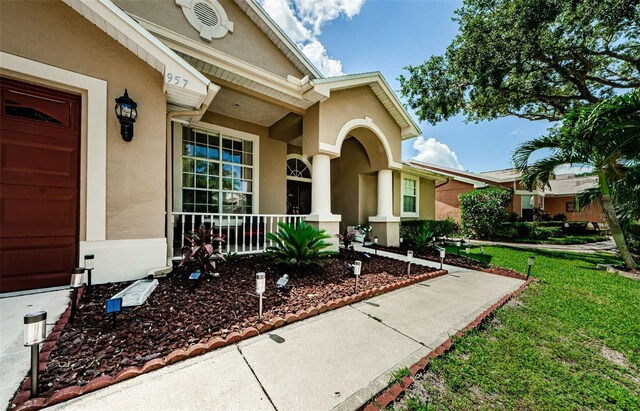 entrance to property with a yard