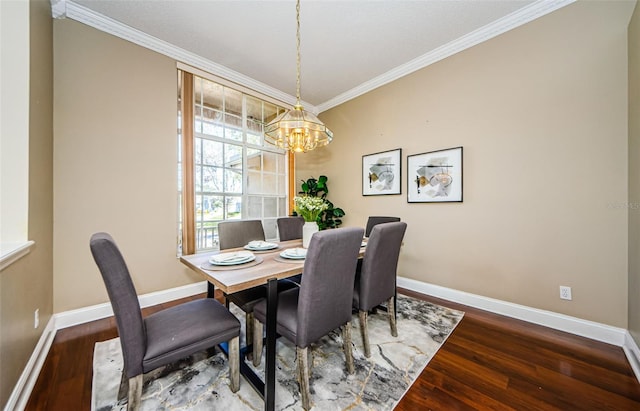 dining space featuring crown molding, wood-type flooring, and a notable chandelier