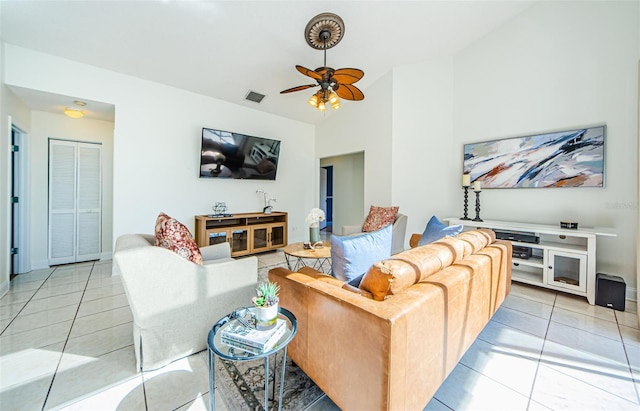 tiled living room with vaulted ceiling and ceiling fan