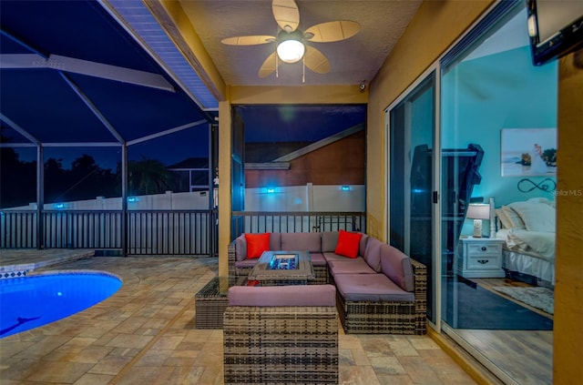 view of patio featuring ceiling fan, outdoor lounge area, and a lanai