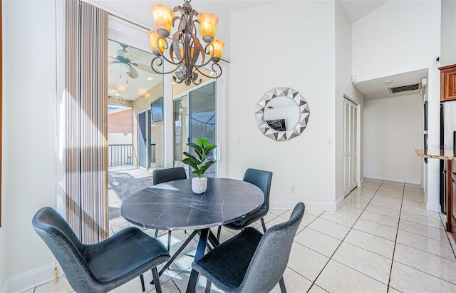 dining area with light tile patterned floors and a chandelier