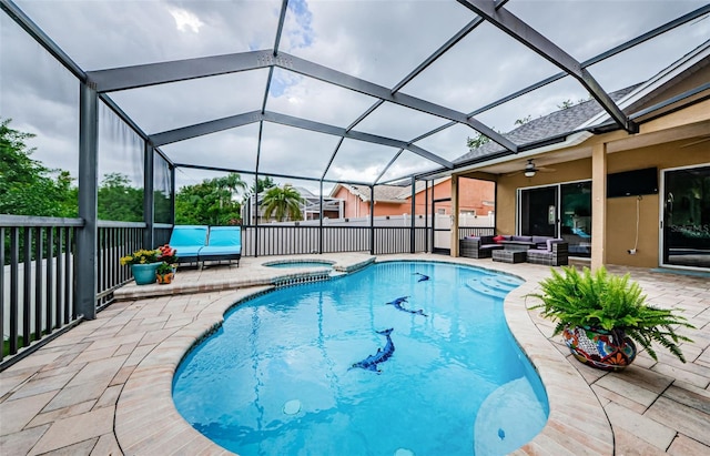 view of swimming pool featuring an in ground hot tub, a lanai, an outdoor living space, and a patio