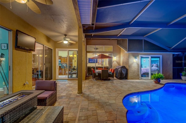 957 Westwinds Blvd, Tarpon Springs, FL 34689 - outdoor pool with a ceiling fan, a patio area, grilling area, and glass enclosure