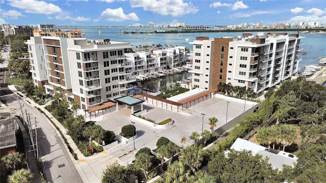 birds eye view of property with a water view