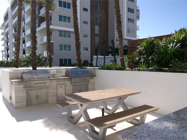 view of patio with area for grilling and an outdoor kitchen