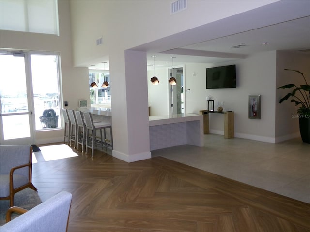 interior space featuring parquet floors and plenty of natural light