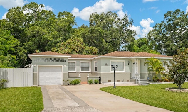 view of front of home featuring a garage and a front lawn