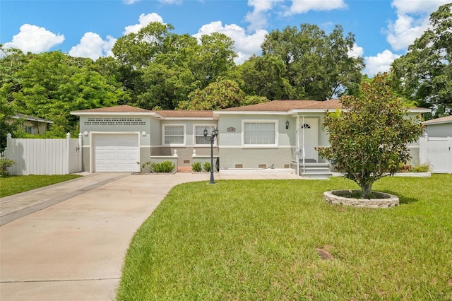 view of front of property featuring a garage and a front lawn