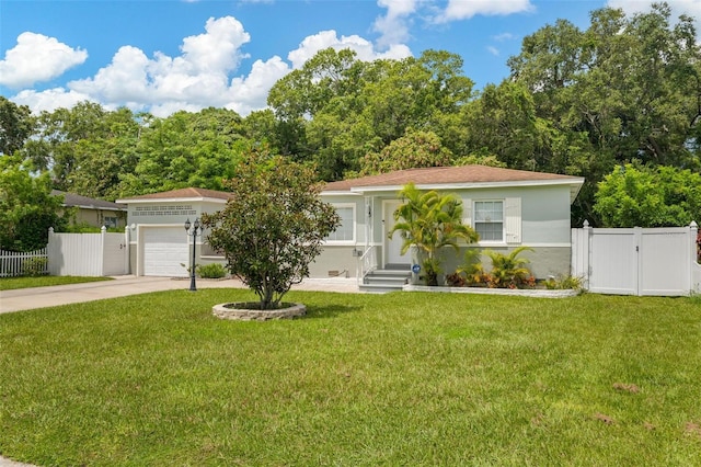 view of front of property with a garage and a front lawn