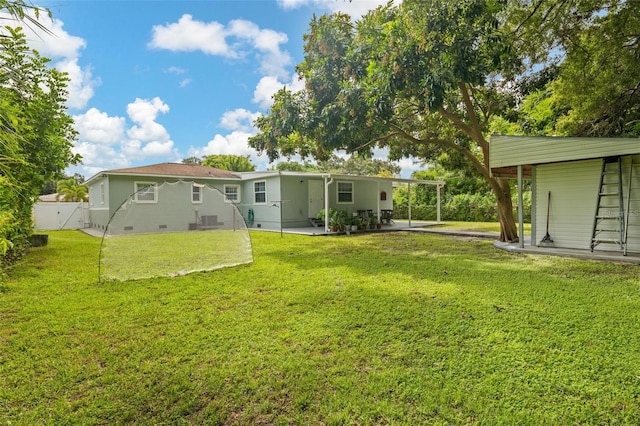 back of house with a yard