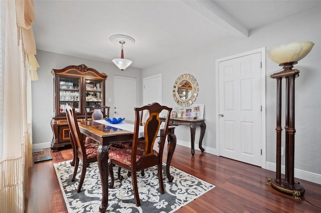 dining room with dark hardwood / wood-style flooring