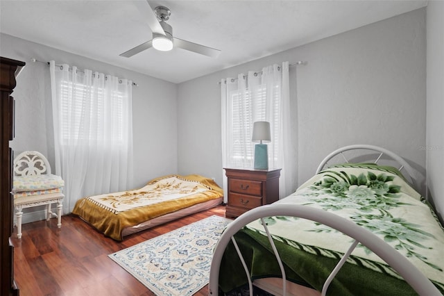 bedroom with hardwood / wood-style flooring and ceiling fan