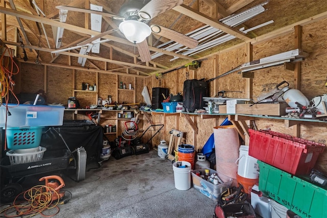 garage with ceiling fan and a workshop area