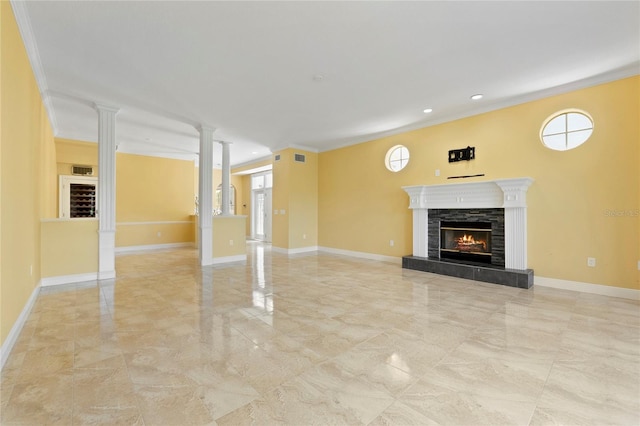 unfurnished living room featuring marble finish floor, a fireplace, baseboards, and ornate columns