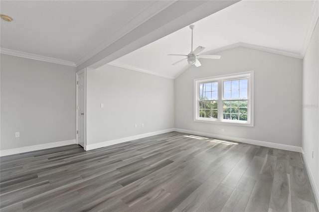 empty room featuring crown molding, vaulted ceiling, dark hardwood / wood-style floors, and ceiling fan