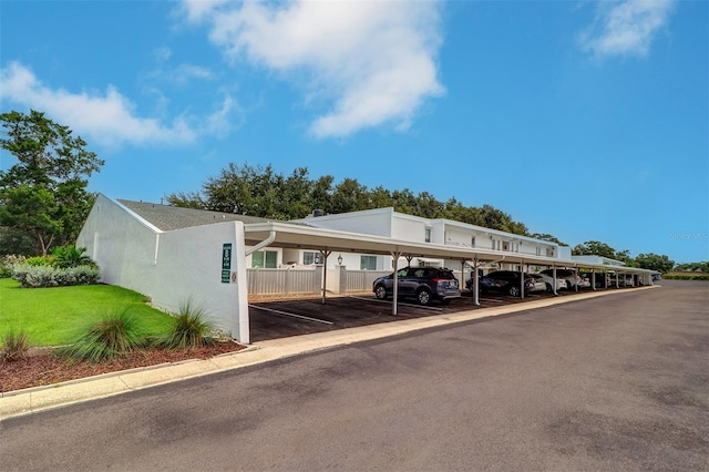 exterior space with a carport