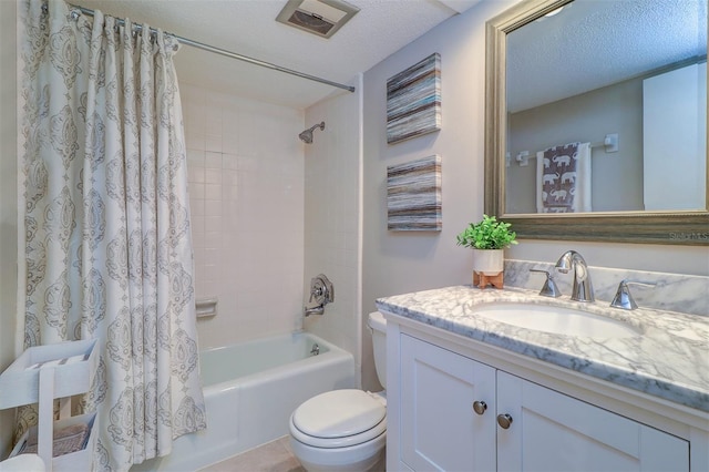 full bathroom with shower / bath combination with curtain, vanity, toilet, and a textured ceiling