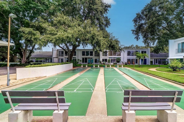 view of property's community featuring a yard