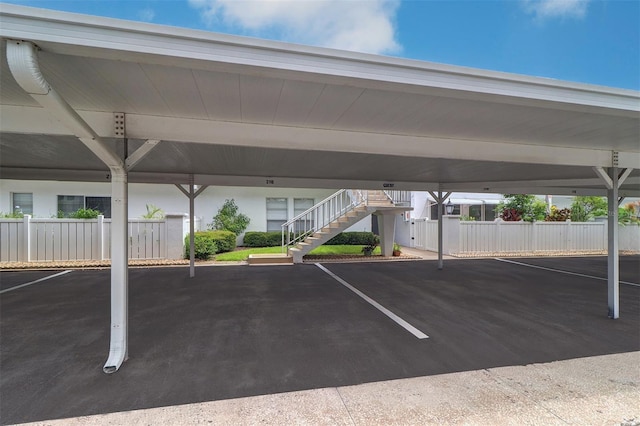 view of vehicle parking featuring a carport