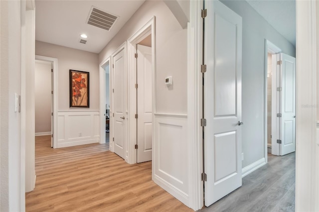 hallway featuring light hardwood / wood-style floors