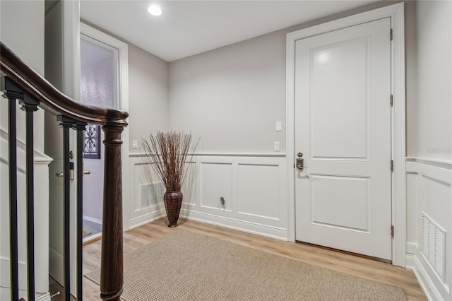 entrance foyer with light hardwood / wood-style flooring