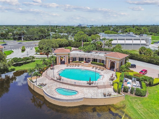 view of swimming pool with a water view