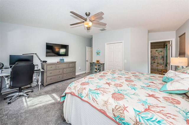 bedroom with a textured ceiling, ceiling fan, a closet, and light colored carpet