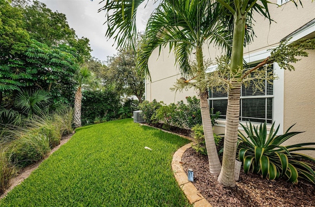 view of yard with central AC