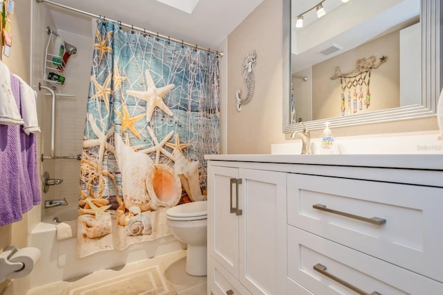 full bathroom featuring vanity, shower / bath combo, tile patterned floors, and toilet