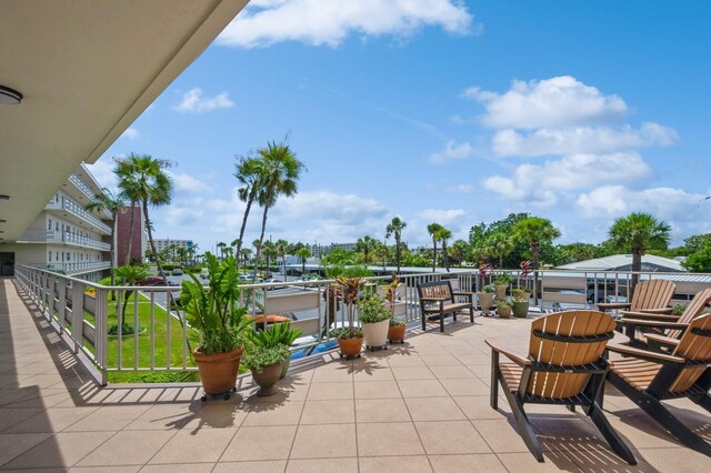 view of patio featuring a balcony