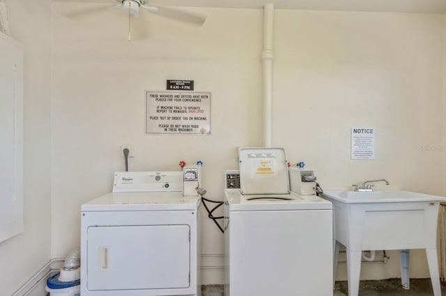 washroom featuring ceiling fan, sink, and washing machine and dryer