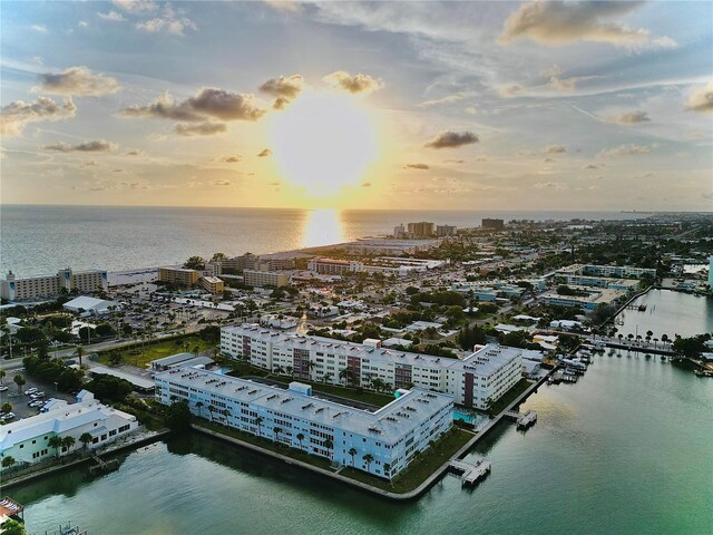 aerial view at dusk with a water view